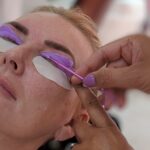 Woman in a beauty salon is getting Eyelash lifting service