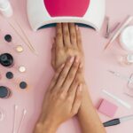 woman in a beauty salon getting her manicure done